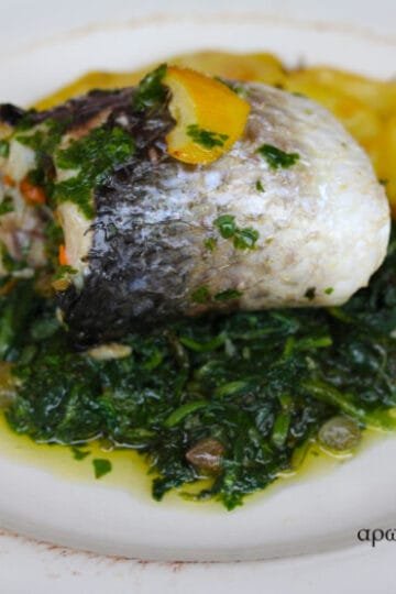 golden grey mullet stuffed filet with capers, parsley and carrots