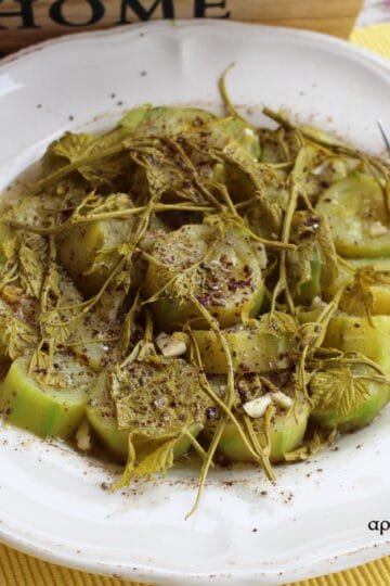 Courgette salad with early spring vinetops
