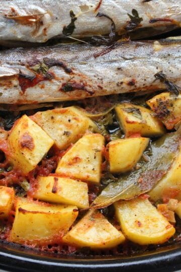 Oven baked pike fish with potatoes