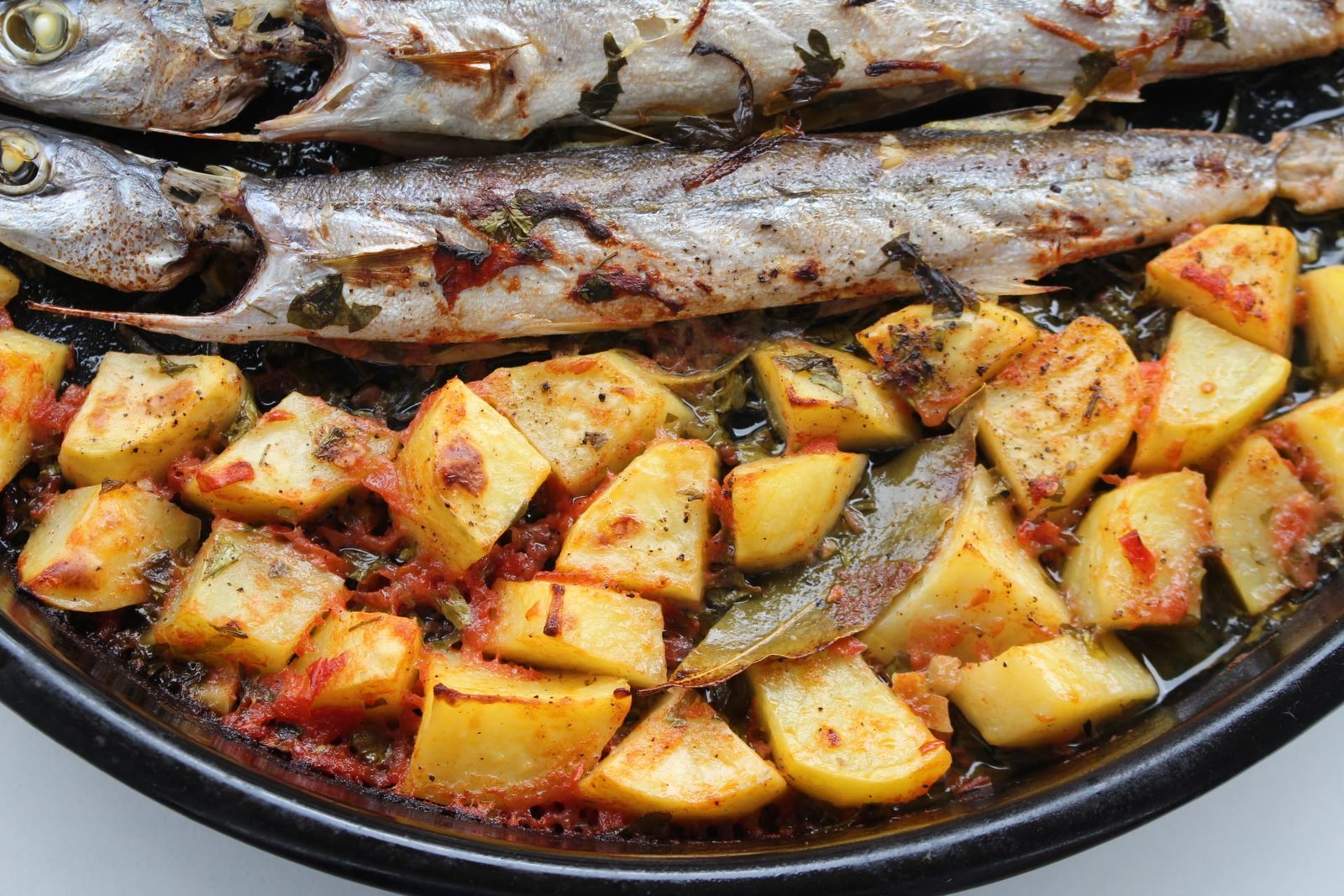 Oven baked pike fish with potatoes