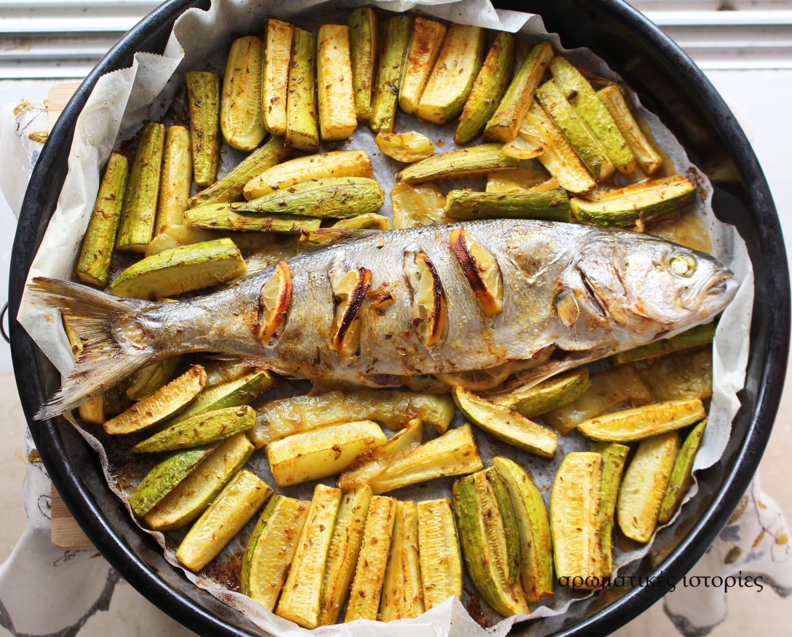 Baked bluefish with courgettes