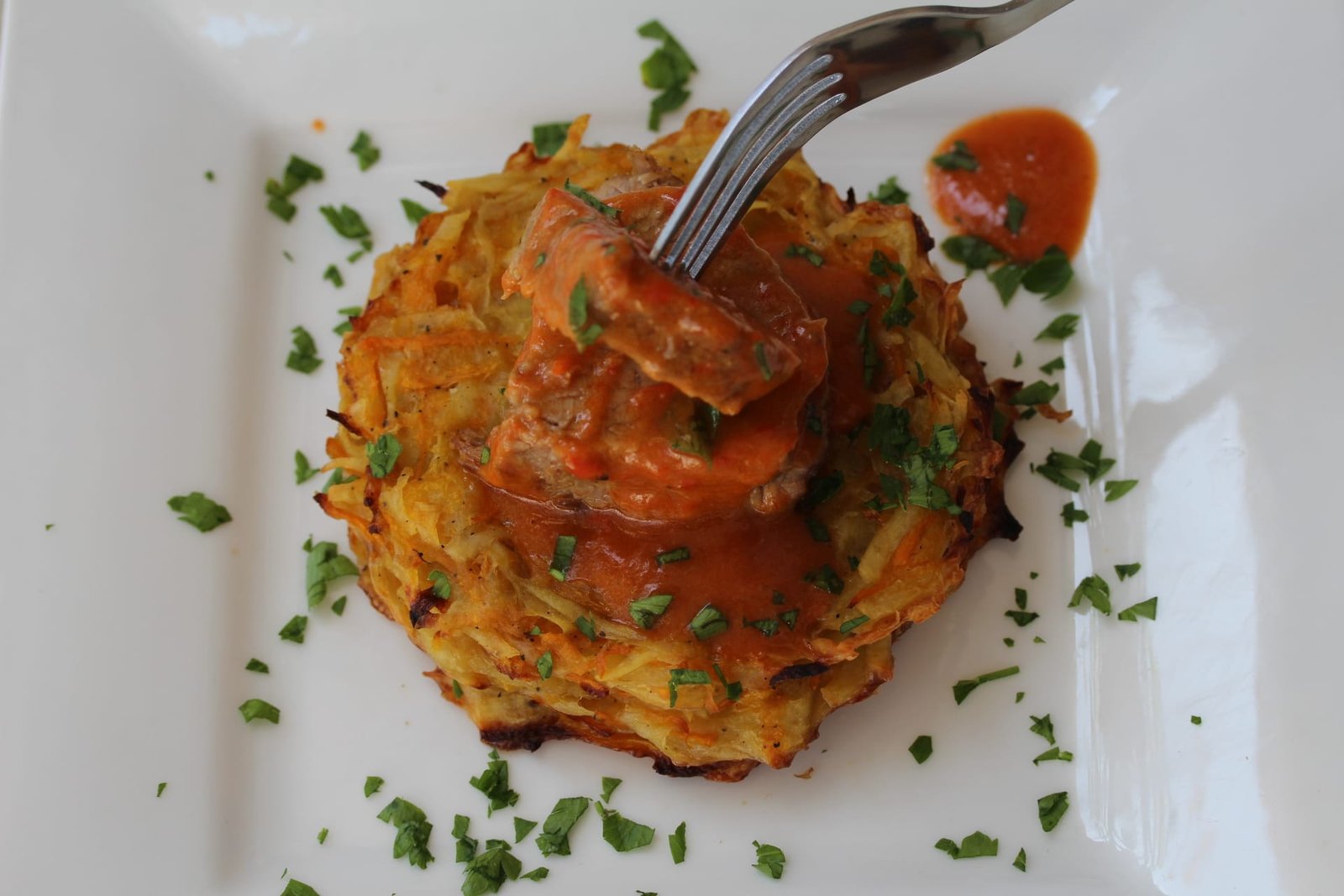 Beef stew with potato and pumpkin rosti