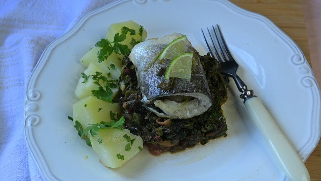 Sea bass fillet with stewed greens