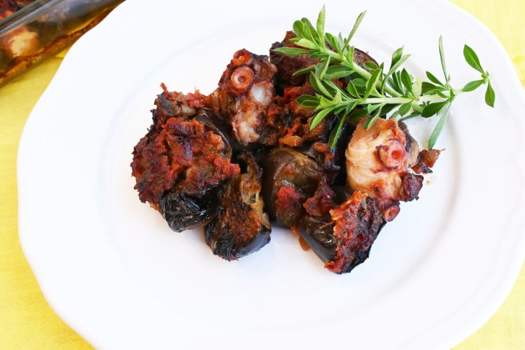 Greek octopus with eggplants in the oven