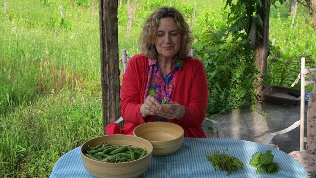 Fresh lemony peas with fresh herbs and early tender spring vinetops