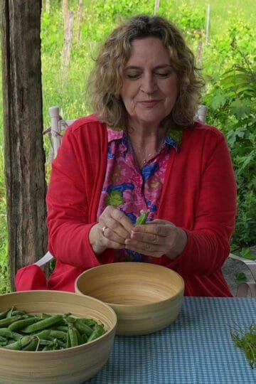 Fresh lemony peas with fresh herbs and early tender spring vinetops