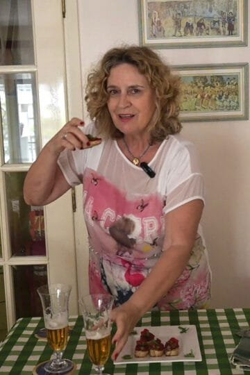Slices of bread with tomato paste, cappers, olives and sea fennel