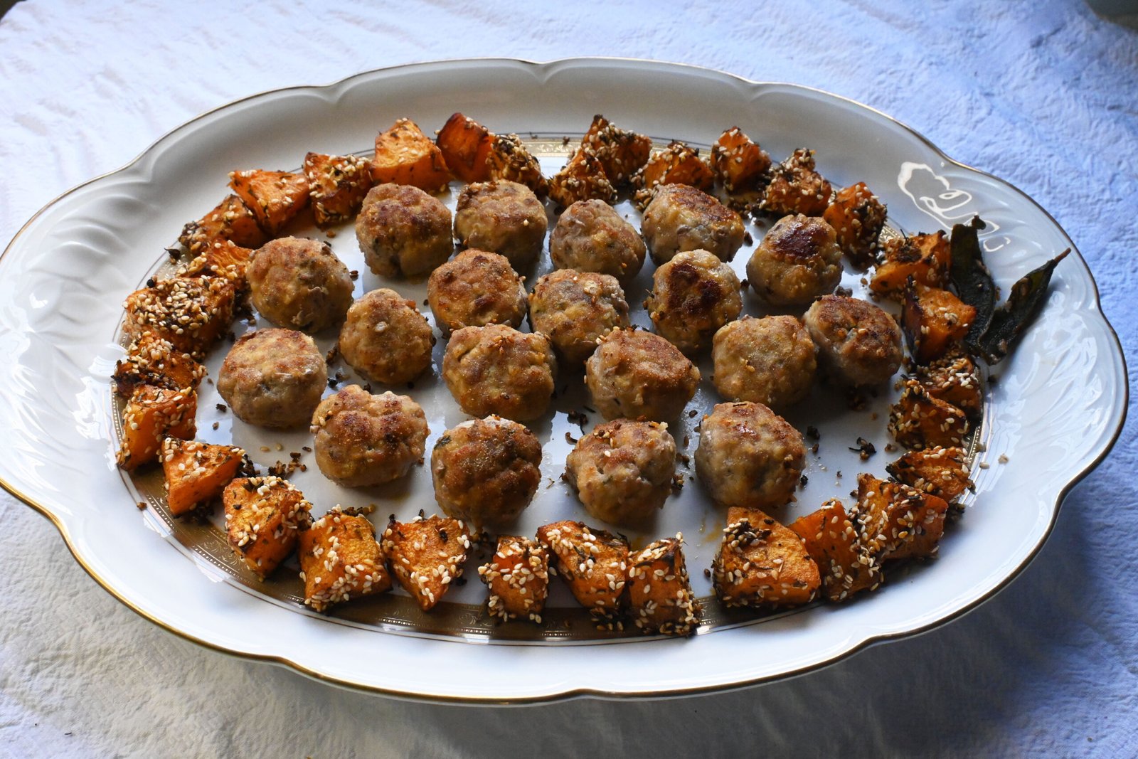 Meatballs with pink sauce and roasted pumpkin bites