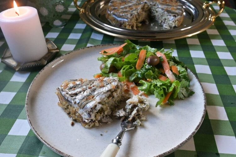 Traditional baked rice with anchovies and pine nuts