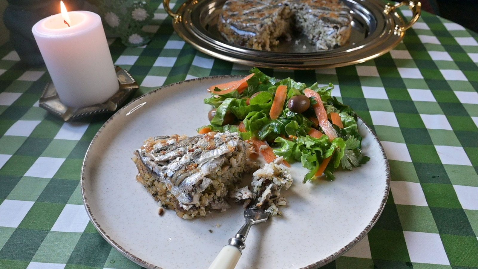 Traditional baked rice with anchovies and pine nuts